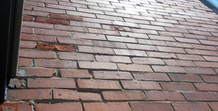 Réfection de ventre de bœuf de murs de brique et de pierre